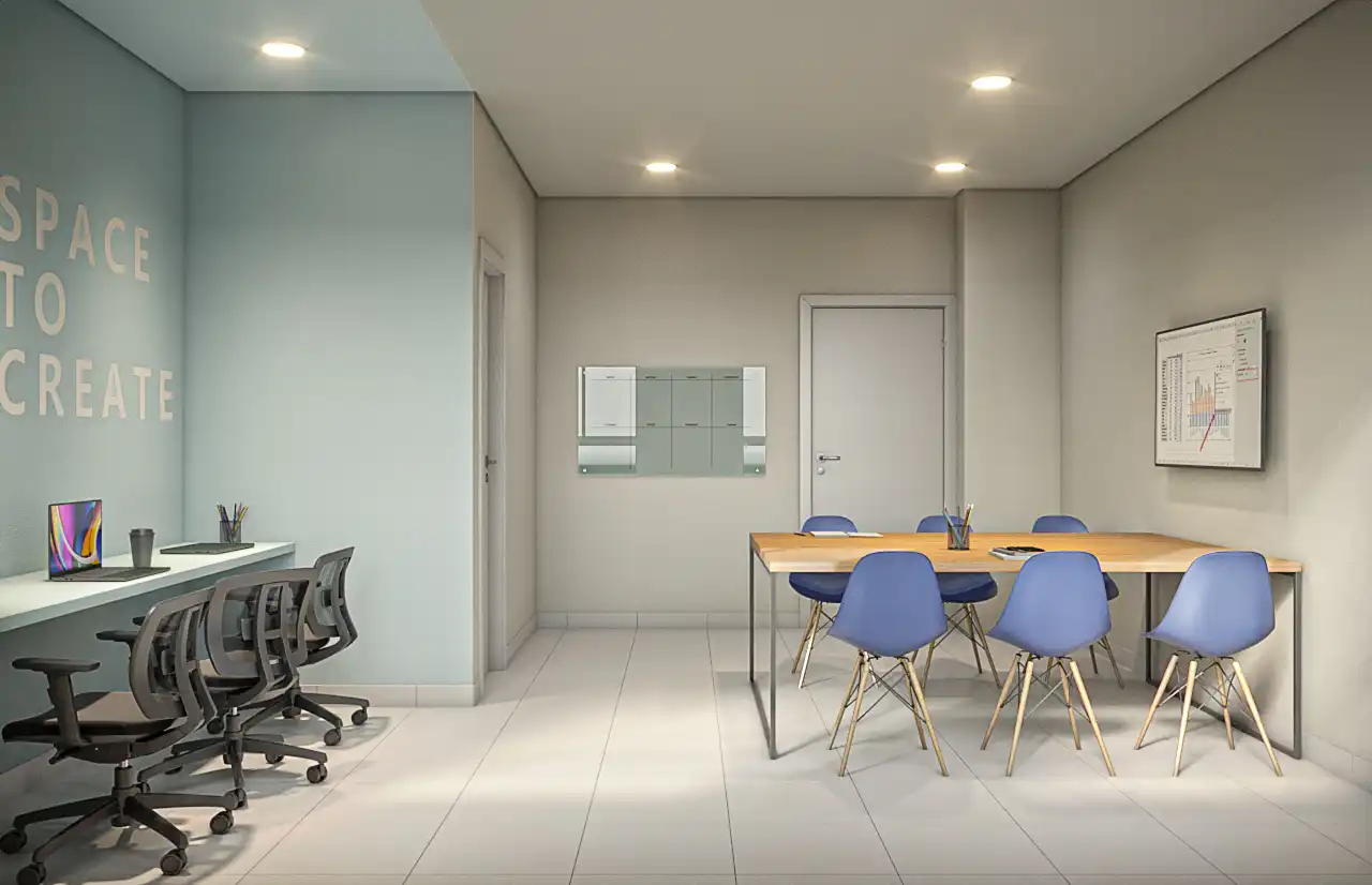Espaço coworking com mesa de reunião e estações de trabalho