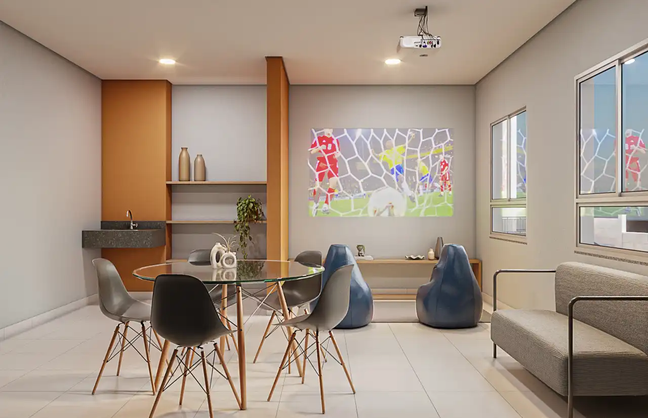 Salão de festas com mesa, poltronas e projetor
